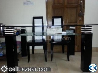 Glass top dining table with chair