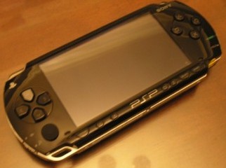 PSP Fat piano black 8 gb included.. cell no 01615698826