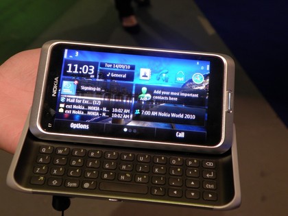 Nokia E7-00 with headphone charger and datacable. large image 0