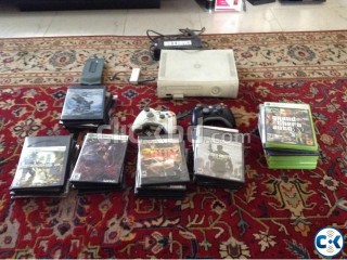 Xbox 360 Arcade with many games and accessories