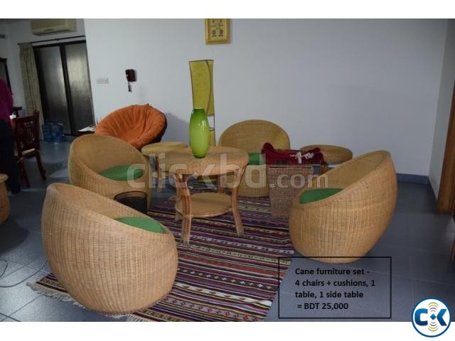 A set of cane chairs with big and small table large image 0
